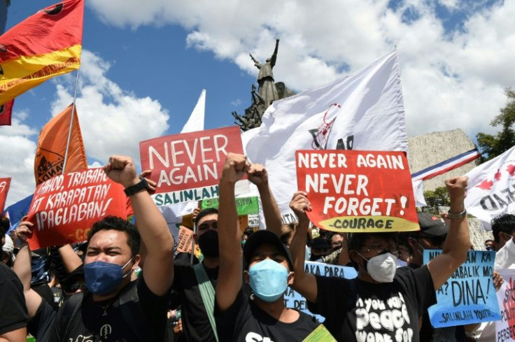 Protesters take to the streets of Manila on the anniversary of former dictator Ferdinand Marcos' ouster