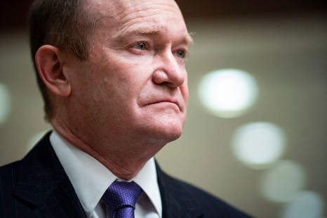 U.S. Senator Chris Coons (D-DE) speaks to reporters during a break from a Senate Armed Services and Foreign Relations joint briefing, on Capitol Hill in Washington, U.S., February 2, 2022. 