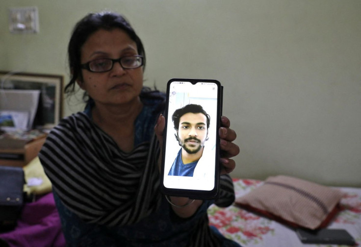 Pratibha Swarnakar, mother of Pushpak Swarnakar, a fifth-year medical student of western Ukraine's Ternopil National Medical University, displays her phone with an image of her son, who she said was among nearly 2,000 Indians taking shelter in bunkers, at