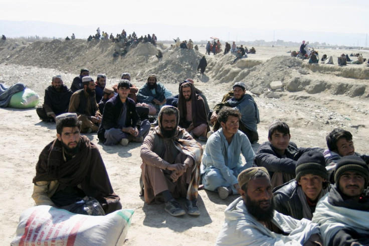 People gather as they wait for the border to open after clashes between Afghan and Pakistani security forces, in the Pakistan-Afghanistan border town of Chaman, Pakistan February 25, 2022.