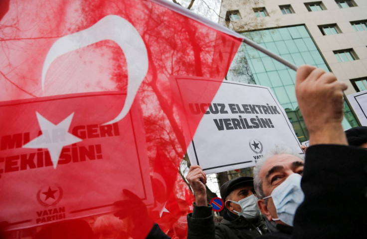 A demonstrator waves a Turkish flag during a protest against high energy prices in Ankara, Turkey February 9, 2022.