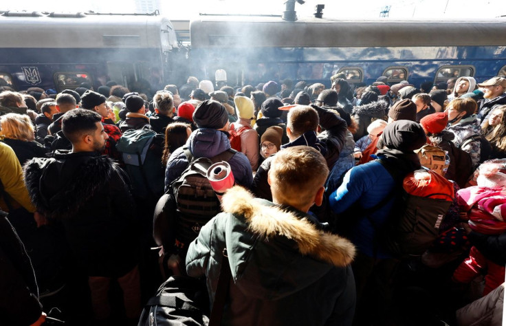 People wait to board a evacuation train from Kyiv to Lviv at Kyiv central train station, Ukraine, February 25, 2022. 