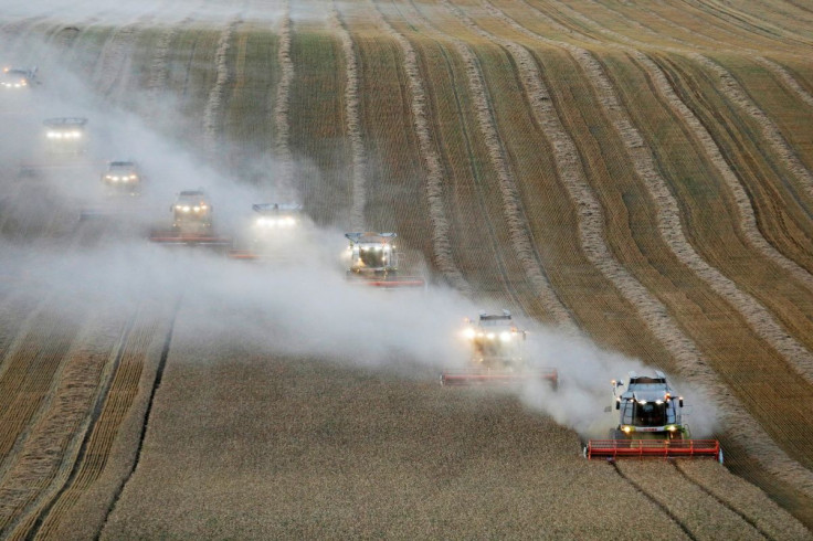 Combines harvest wheat in a field near the village of Suvorovskaya in Stavropol Region, Russia July 17, 2021.