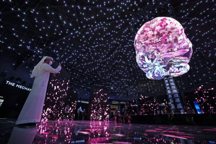 A visitor takes pictures inside the Russian Pavilion of Expo 2020, in Dubai on October 5, 2021