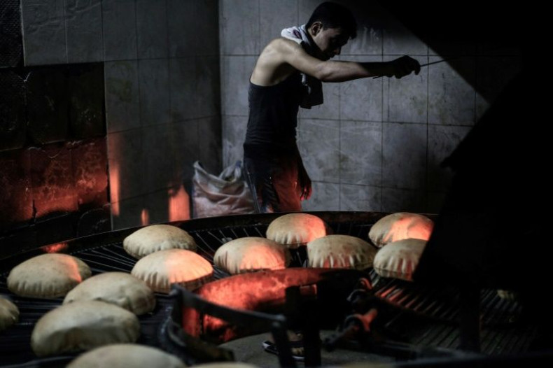 A Syrian man works at a bakery in Douma