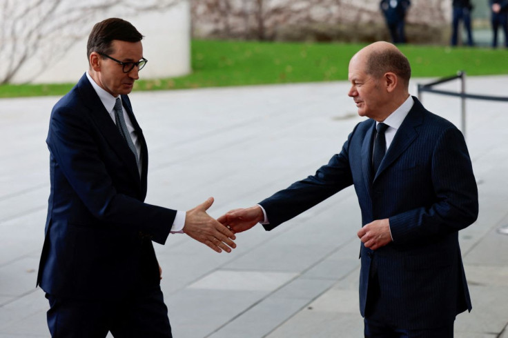 German Chancellor Olaf Scholz and Polish Prime Minister Mateusz Morawiecki shake hands as they meet to discuss sanctions on Russia, in Berlin, Germany, February 26, 2022.