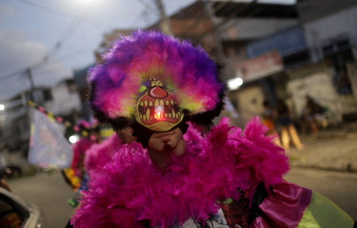 "Bate-bola" (slam the ball) revellers perform during the traditional carnival festivity in a suburb, despite Carnival celebrations being postponed to April due to the coronavirus disease (COVID-19) outbreak in Rio de Janeiro, Brazil, February 25, 2022.