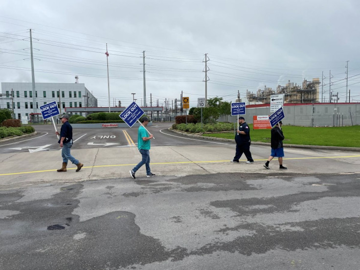 United Steelworkers union members picket outside the Exxon Mobil Beaumont, after being locked out of the plant by the company, in Beaumont, Texas, U.S., May 1, 2021.