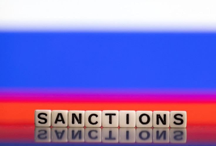 Plastic letters arranged to read "Sanctions" are placed in front of Russian flag colors in this illustration taken February 25, 2022. 