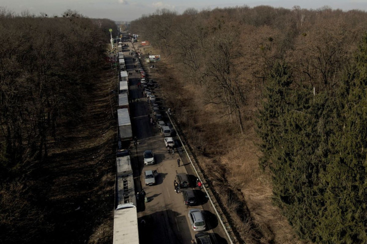 A screen grab from drone footage shows cars forming a line that stretches some 35 km from the Shehyni border crossing to Poland as people try to flee Russia's military operation against Ukraine outside Mostyska, Ukraine, February 26, 2022.  
