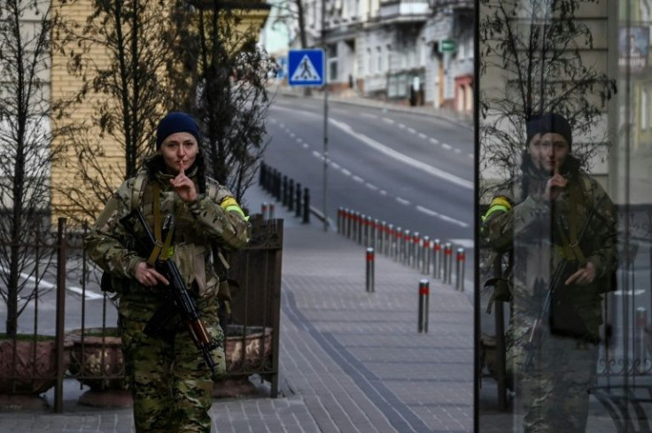 The empty streets of Kyiv are filled with soldiers enforcing a military cerfew