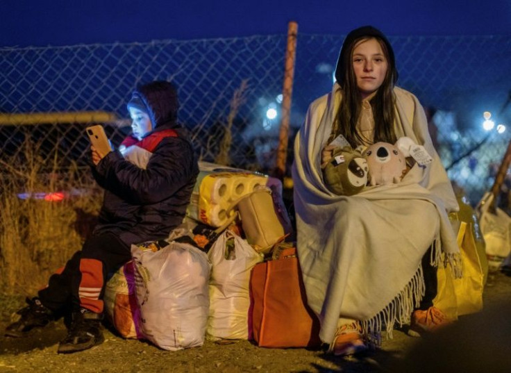 By midday Sunday, nearly 200,000 people had already crossed into Poland from Ukraine