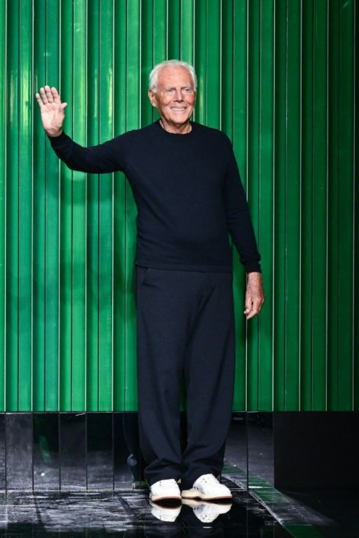 Uber-designer Giorgio Armani acknowledges the public after his catwalk show as Milan pulled off its usual mix of insouciance, elegance and cool chic