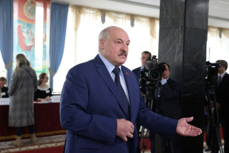 Belarus' President Alexander Lukashenko speaks to the media after casting his ballot in the referendum on the constitutional amendments at a polling station in Minsk on February 27, 2022.