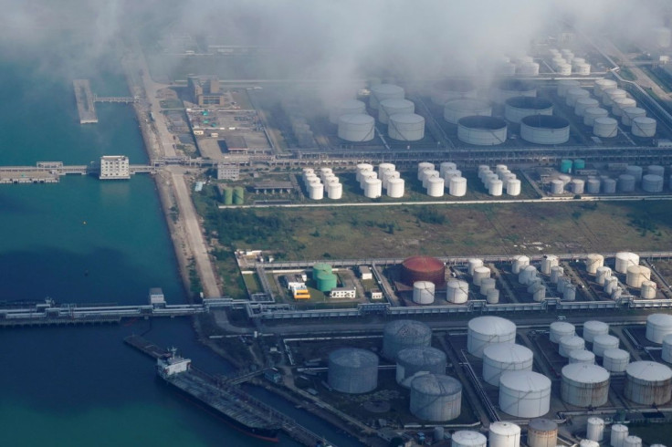 Oil and gas tanks are seen at an oil warehouse at a port in Zhuhai, China October 22, 2018. 