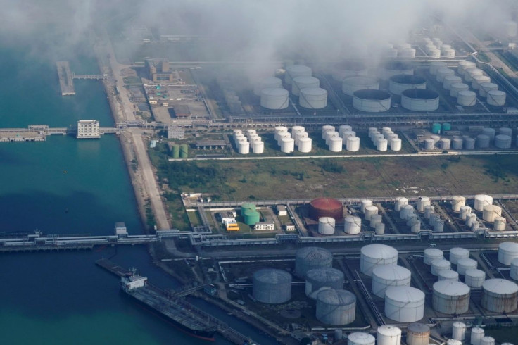Oil and gas tanks are seen at an oil warehouse at a port in Zhuhai, China October 22, 2018.