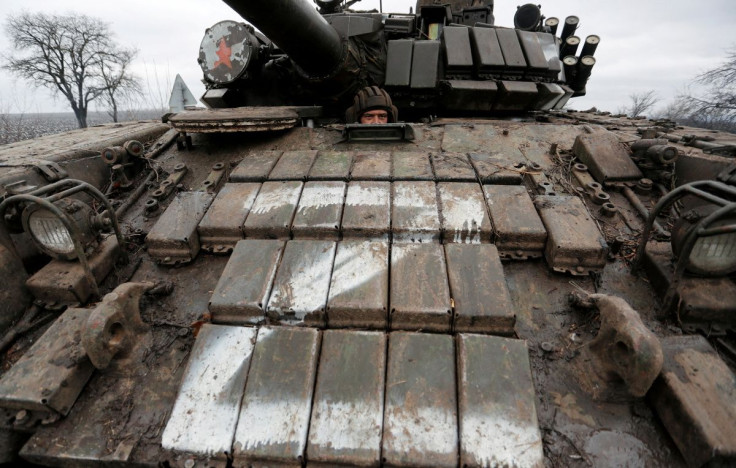 A serviceman of pro-Russian militia is seen inside a tank of armed forces of the separatist self-proclaimed Luhansk People's Republic (LNR) on a road in the Luhansk region, Ukraine February 27, 2022.