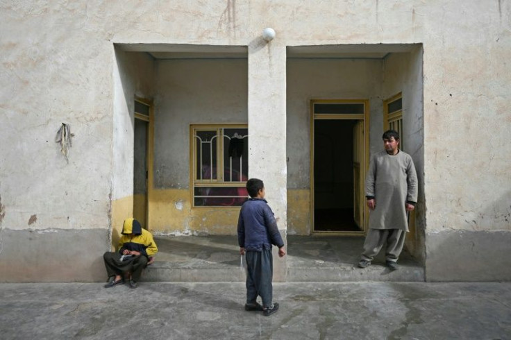 Nooruddin, who sold his kidney to raise money for his family, talks with his youngest son Javid at their house in the Khwaja Koza Gar area in HeratJobless, debt ridden, and struggling to feed his children, Nooruddin felt he had no choice but to sell a