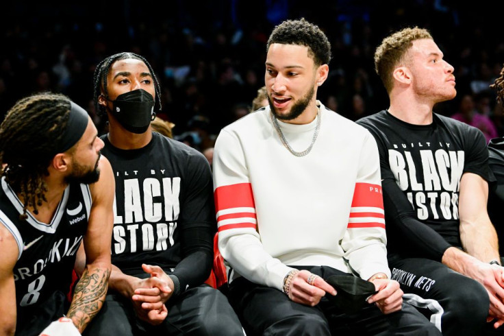 Ben Simmons of the Brooklyn Nets speaks with Patty Mills