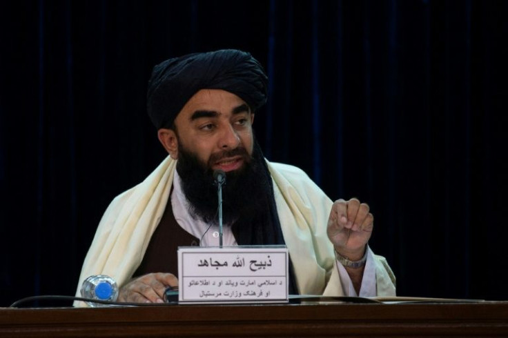Taliban spokesman Zabihullah Mujahid telling the press that further evacuation flights of Aghans had been banned