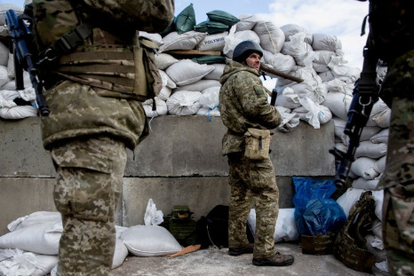 Ukrainian service members are seen after Russia launched a massive military operation against Ukraine, at a check point in the city of Zhytomyr, Ukraine February 27, 2022.  