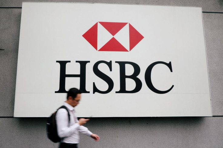 A man walks past a logo of HSBC at its headquarters in Kuala Lumpur, Malaysia August 6, 2019. 