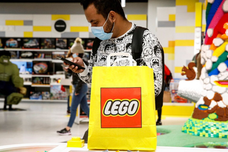 A customer uses his phone while shopping in the 5th Avenue Lego store in New York City, U.S., September 28, 2021.