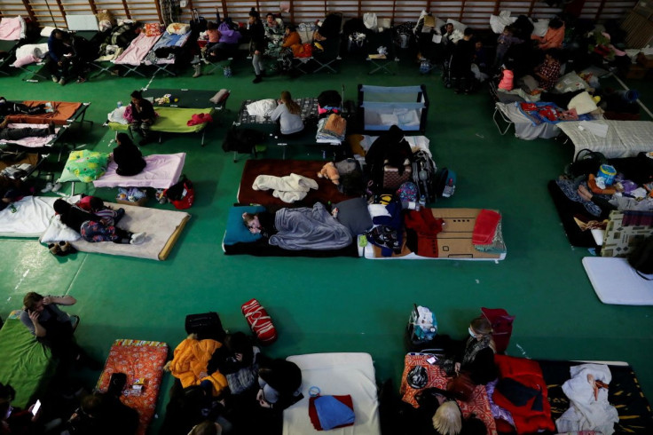 People from Ukraine rest at a refugee shelter, after Russia launched a massive military operation against Ukraine, in Tiszabecs, Hungary February 28, 2022. 