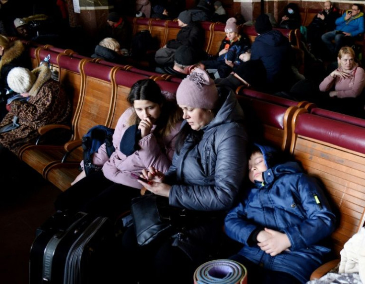 Women and children rest where they can at Lviv rail station