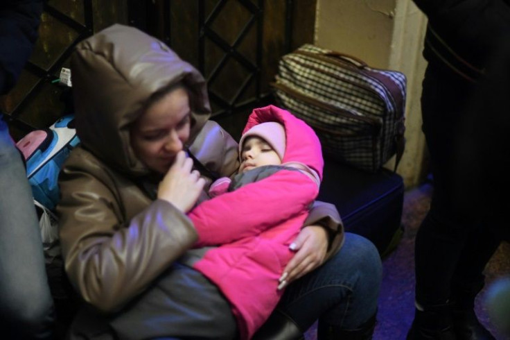 Some women, alone with their children, said their husbands had stayed behind to fight