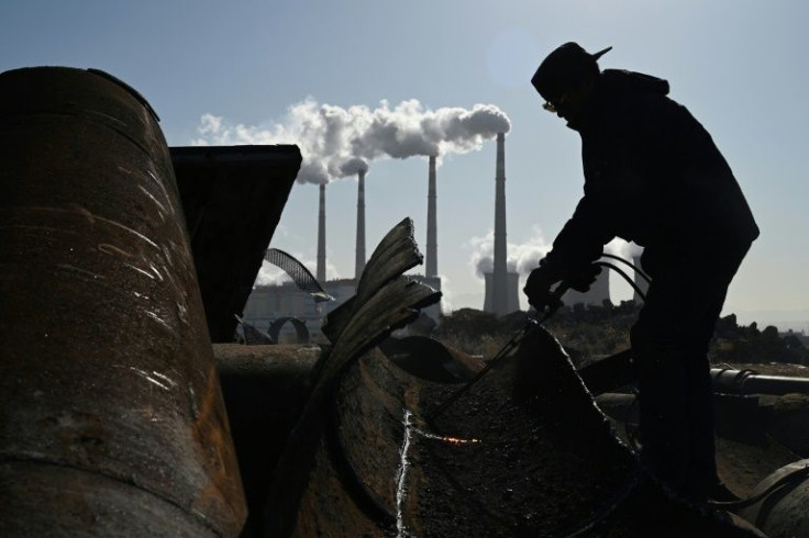 China has promised to slash emissions -- but is struggling to kick its coal habit as economic growth slows