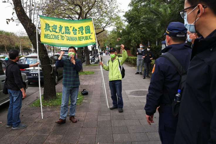 People from pro-Taiwan independent group gather around the airport to welcome the former U.S. senior officials arriving in Taipei, Taiwan March 1, 2022.
