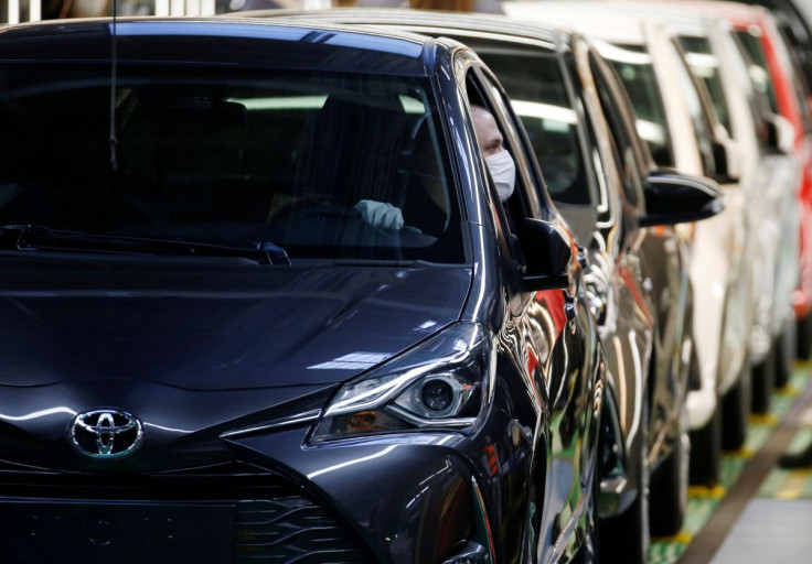 Employees wearing protective masks work at the Toyota Motor Manufacturing France plant as it resumes its operations after five weeks of closure during a lockdown amid the coronavirus disease (COVID-19) outbreak, in Onnaing, France, April 23, 2020.