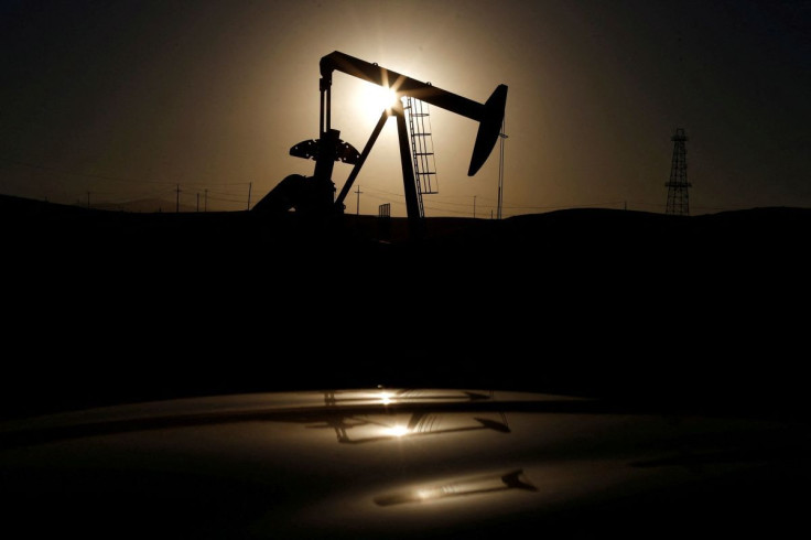 A pump jack is seen at sunrise near Bakersfield, California October 14, 2014.  