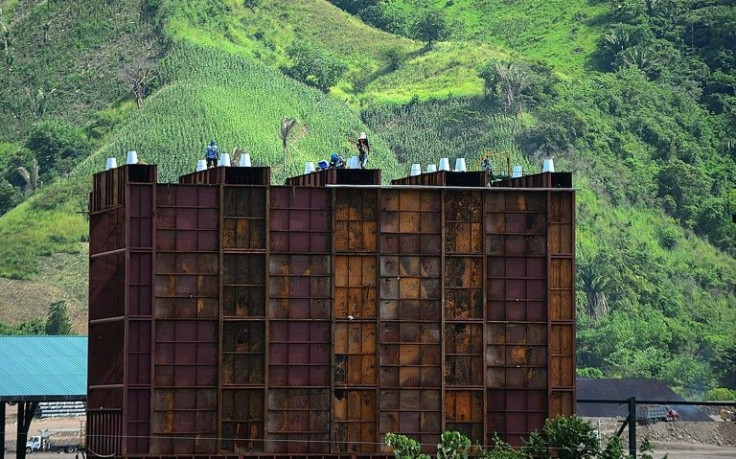 Men work at Los Pinares iron oxide mine, on the outskirts of Tocoa, Honduras in September 2021