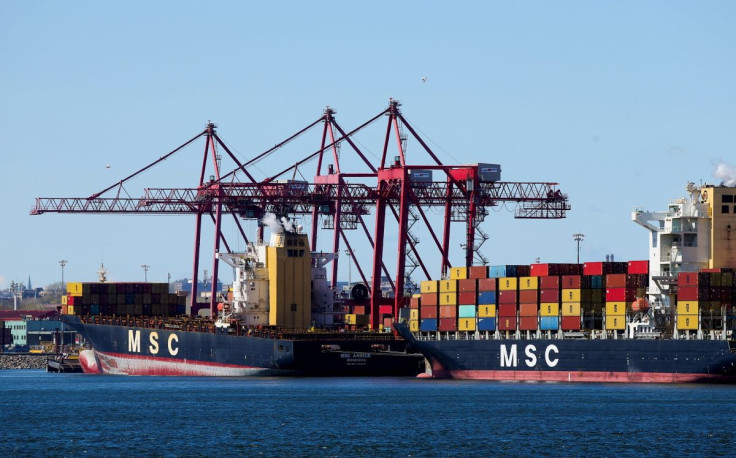 Cargo ships with their shipping containers are seen in the Port of Montreal in Montreal, Quebec, Canada, May 6, 2021.