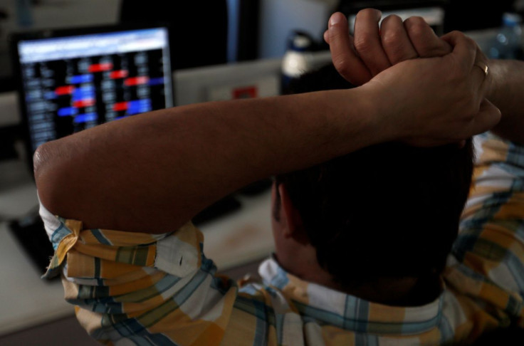 A broker reacts while trading at his computer terminal at a stock brokerage firm in Mumbai, India, February 1, 2020. 