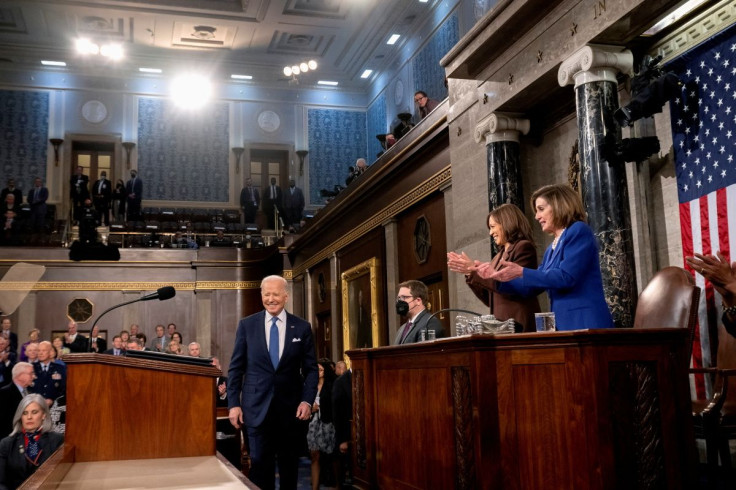 U.S. Vice President Kamala Harris and U.S. House Speaker Nancy Pelosi (D-CA) look on as U.S. President Joe Biden arrives to deliver the State of the Union address at the U.S. Capitol in Washington, DC, U.S, March 1, 2022.  Saul Loeb/Pool via REUTERS