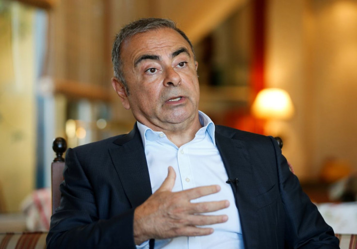 Fugitive former car executive Carlos Ghosn, gestures as he talks during an interview with Reuters in Beirut, Lebanon June 14, 2021. 
