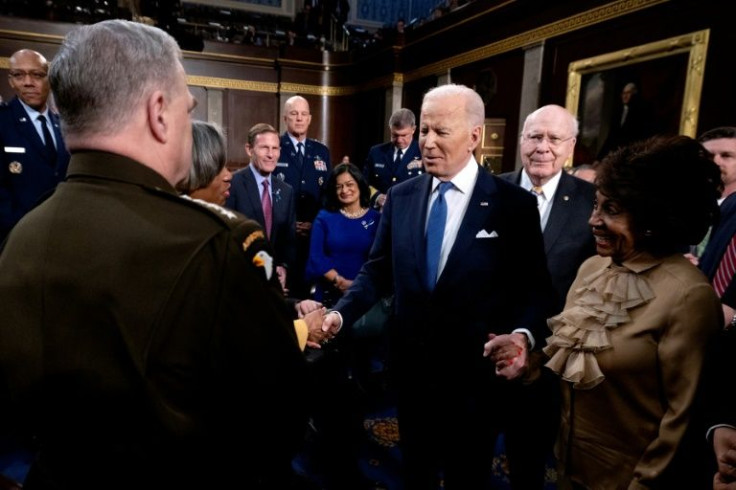 As he left the chamber, the veteran former senator Joe Biden embraced the post-Covid reality with one of his favorite activities -- extended and energetic handshaking and chatting with massed politicians