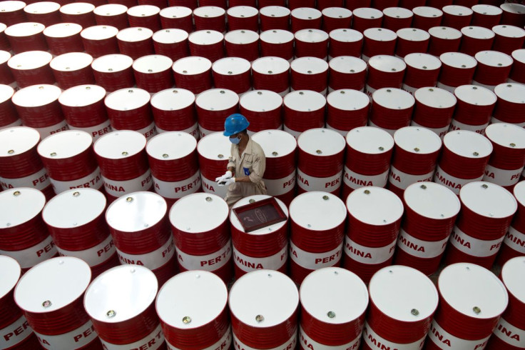 A worker prepares to label barrels of lubricant oil at the state oil company Pertamina's lubricant production facility in Cilacap, Central Java, Indonesia November 6, 2017 in this photo taken by Antara Foto. Antara Foto/Rosa Panggabean/ via