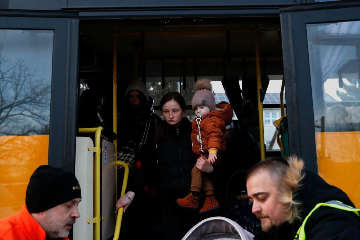 A woman fleeing Russia's invasion of Ukraine meets with her daughter near a refugee shelter, in Tiszabecs, Hungary, March 2, 2022. 