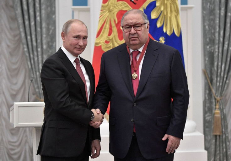 Russian President Vladimir Putin shakes hands with Russian businessman and founder of USM Holdings Alisher Usmanov at the Kremlin in Moscow, Russia November 27, 2018. Sputnik/Alexei Nikolsky/Kremlin 