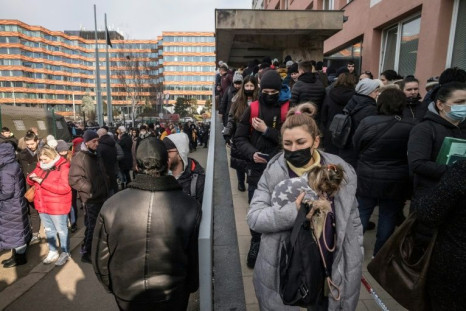 Ukrainian refugees queue to file for residence permits at Prague's foreigner police headquarters