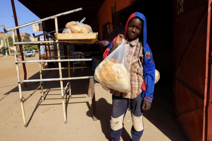 A boy carries a bag of bread in Khartoum, Sudan February 21, 2022. Picture taken January 21, 2022.