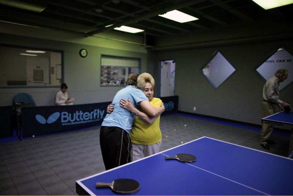 Holocaust survivor Betty Stein, 92, hugs coach Bella Livshin after playing ping pong at a program for people with Alzheimer039s and dementia at the Arthur Gilbert table tennis center in Los Angeles