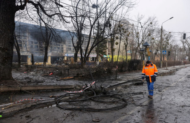 A man walks through the site of a blast targeted at the TV tower, as Russia's invasion of Ukraine continues, in Kyiv