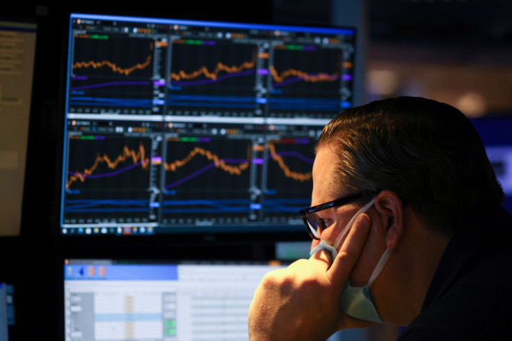 A trader works on the trading floor on the last day of trading before Christmas at the New York Stock Exchange (NYSE) in Manhattan, New York City, U.S., December 23, 2021.