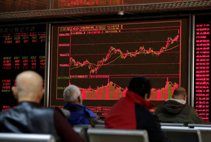 A board shows stock information at a brokerage office in Beijing, China January 2, 2020. 