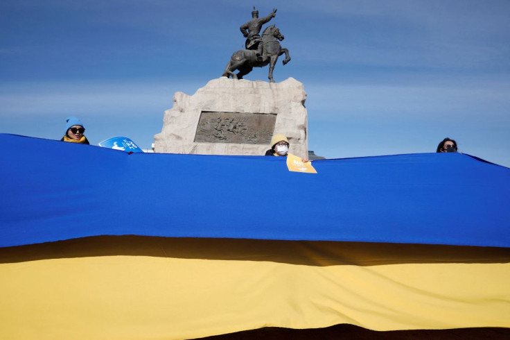 Demonstrators attend a rally in support of Ukraine following Russia's invasion of the country, near the Government Palace on Sukhbaatar Square in Ulaanbaatar, Mongolia March 1, 2022. 